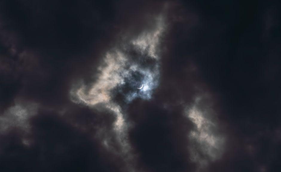 Cloudy skies test patience of Scotland's eclipse hunters during rare celestial event